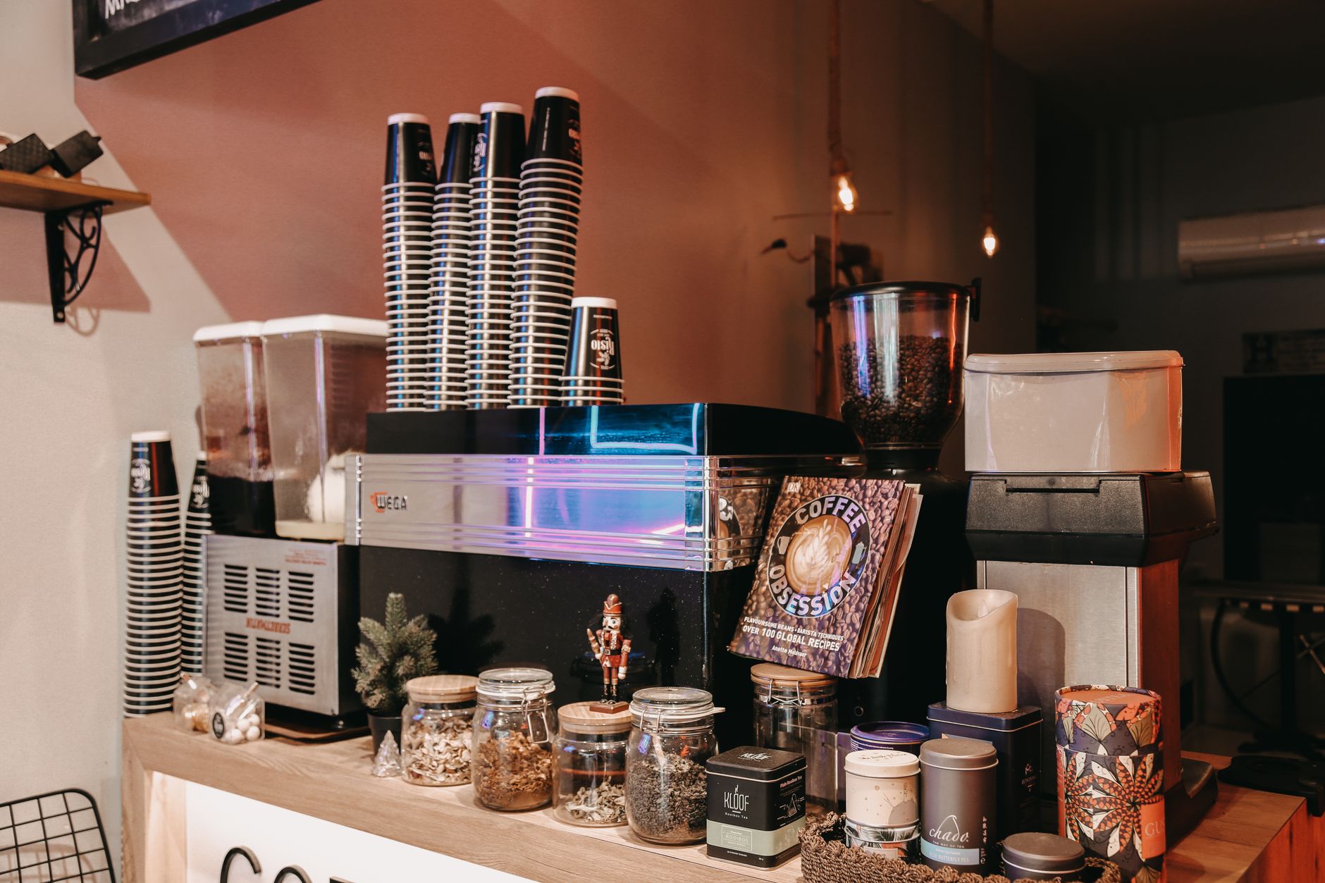 Warm interior of the coffee shop with a wooden counter and espresso machine